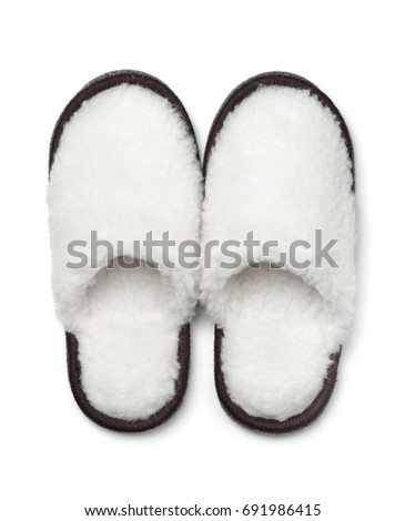 Pair of soft fur slippers isolated on white