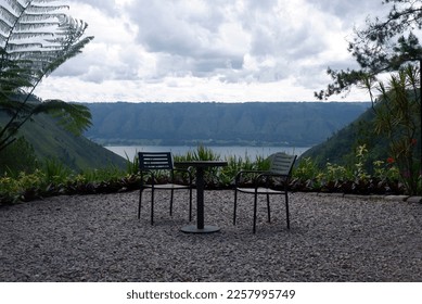 A pair of special seats with views of lake Toba - Shutterstock ID 2257995749