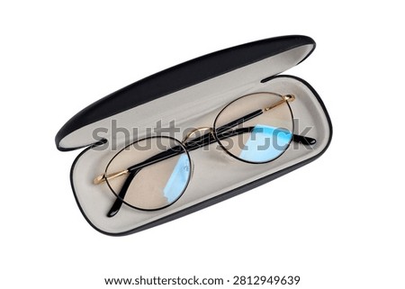 Pair of spectacles in hard case isolated on white background