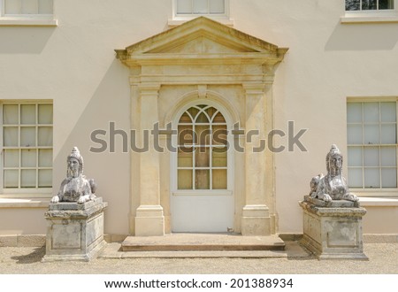 A pair of Sphinxes either side of a door at Saltram, Plympton, near Plymouth, Devon, England, UK