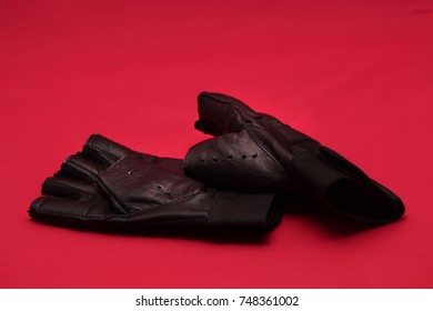 A pair of sports gloves isolated on red background