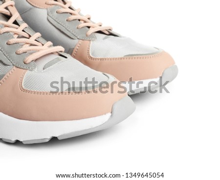 Pair of sports shoes on white background, closeup
