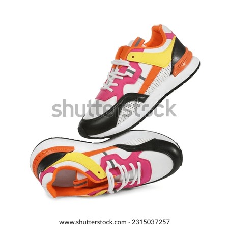 Pair of stylish colorful sneakers isolated on white