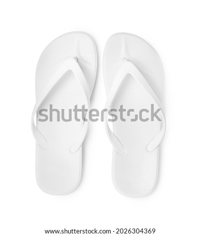 Pair of stylish flip flops isolated on white, top view