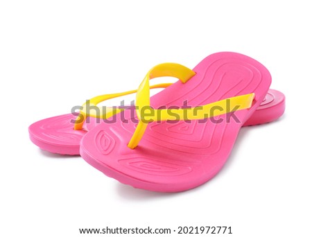 Pair of stylish pink flip flops isolated on white. Beach object