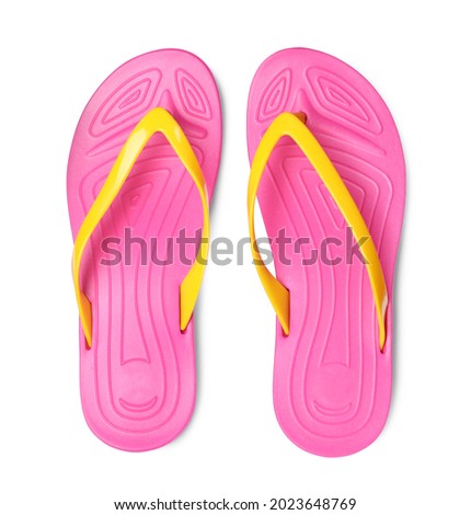 Pair of stylish pink flip flops isolated on white, top view