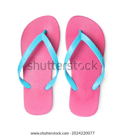 Pair of stylish pink flip flops isolated on white, top view
