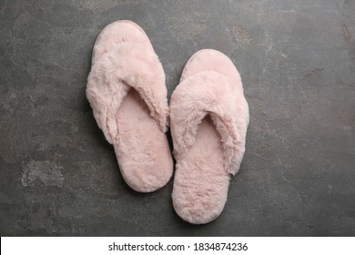 Pair of stylish soft slippers on grey background, flat lay