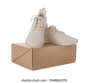 Pair Of Stylish Sport Shoes And Box On White Background