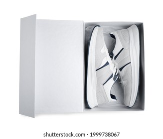 Pair Of Stylish Sport Shoes In Box On White Background, Top View