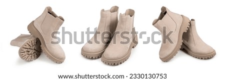 A pair of suede women's half-boots on a white background. Stylish demi-season women's shoes