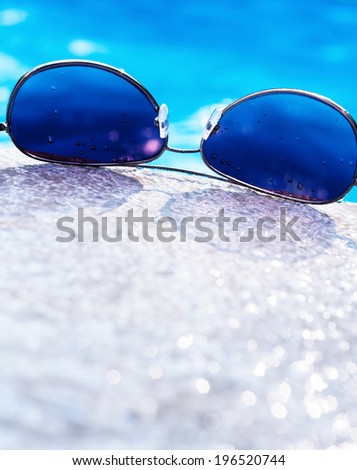 A pair of sunglasses with a blue tint.