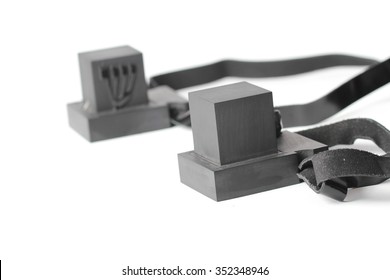 pair of tefillin , A symbol of the Jewish people, a pair of tefillin with black straps, isolated on a white background