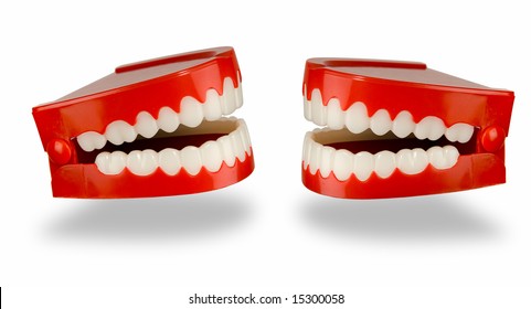 A pair of toy chattering teeth isolated on a white background with a clipping path