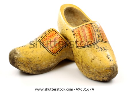 pair of traditional Dutch yellow wooden shoes  on a white background