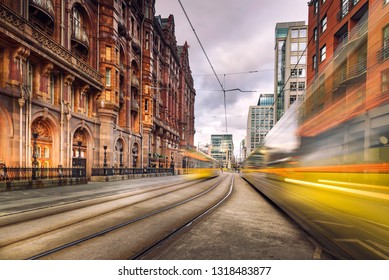 Pair of tram light trails at St Peters Square, Manchester, England.