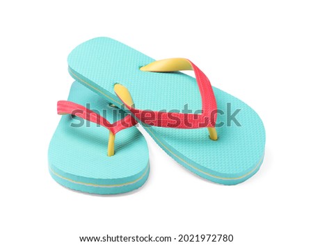 Pair of turquoise flip flops isolated on white