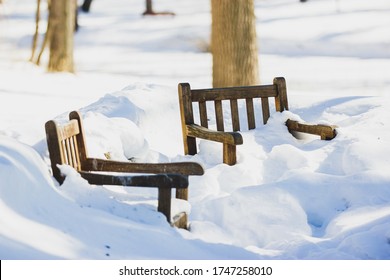 Pair Of Two Chairs Buried In Snow