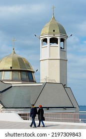 A Pair Walking Near The Port Church In Odesa Ukraine