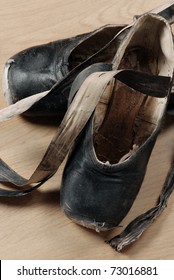 A Pair Of Well Worn Black Ballet Shoes