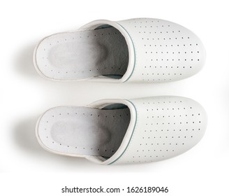 A pair of white professional ventilated work clogs isolated over white