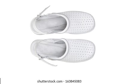 A pair of white professional ventilated work clogs isolated over white