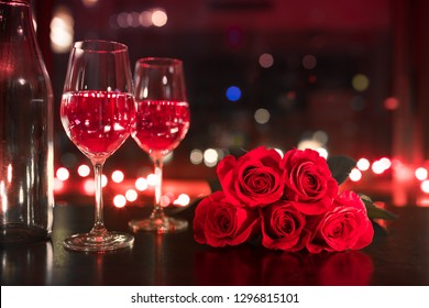 Pair Of Wine Glasses Red Roses In A Hotel Room. Valentines Gift, Love, Date Night Concept. 