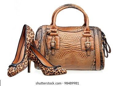 Pair of women shoes and handbag isolated over white - Powered by Shutterstock