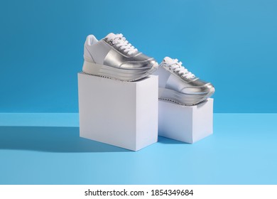 Pair Of Womens Fashionable Silver Sneakers