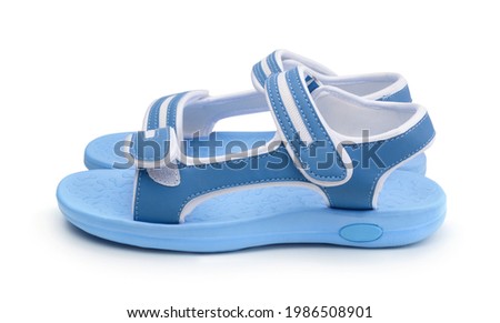Pair of womens leather blue summer sandals isolated on white.