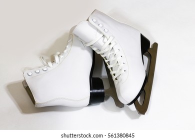 Pair Of Women's White Figure Ice Skates On White Background