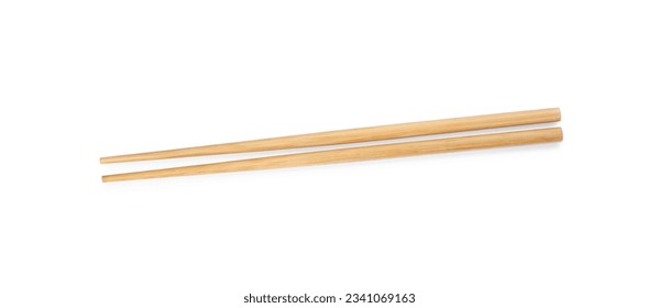 Pair of wooden chopsticks isolated on white, top view