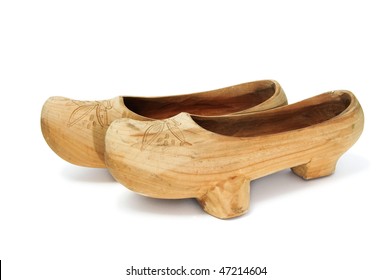 a pair of wooden clogs isolated on a white background
