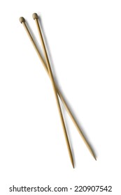 Pair Of Wooden Knitting Needles Isolated Over White