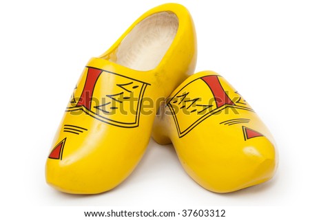 Pair of wooden shoes - klompen. Traditional dutch footwear for farmers. Isolated on white background
