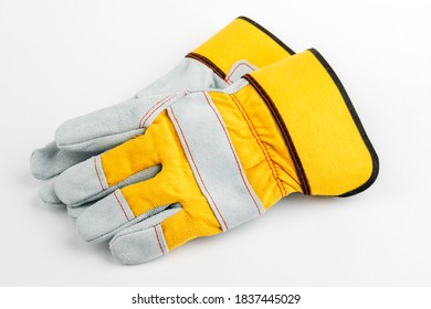 Pair Of Yellow Construction Gloves On A White Insulated Background.