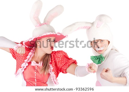 pair of the young actors in the costumes of the cute bunnies fighting