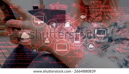 Pairing developers analyzing network icon on code overlay at wooden desk, with laptop smartphone. Technology, collaboration, innovation, connectivity, digital, workspace, modern