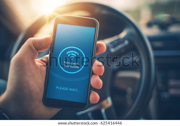 Pairing Smartphone with Car\
Multimedia Audio System. Using Mobile Phone Device While Driving.\
Hands Free Talking and Listening Online Music While Traveling by\
Car.