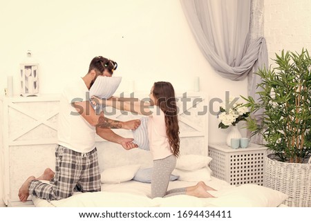 Similar – Image, Stock Photo Man showing baby clothes to pregnant woman