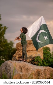 Pakistan Boy Child Holding Pakistan Flag, F-9 Park, Islamabad, Pakistan.