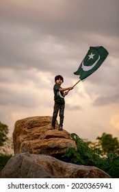 Pakistan Boy Child Holding Pakistan Flag, F-9 Park, Islamabad, Pakistan.