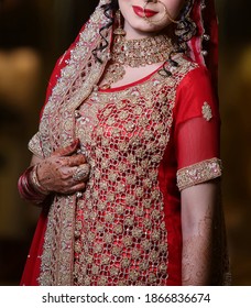 Pakistan Bridal  Wearing Wedding Red Lehenga Suit, Bridal Getting Ready Her Wedding Day
Karachi, Pakistan, November 25, 2019