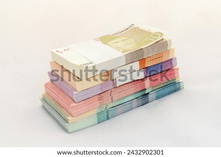 Pakistan currency banknote bundles on white isolated background.