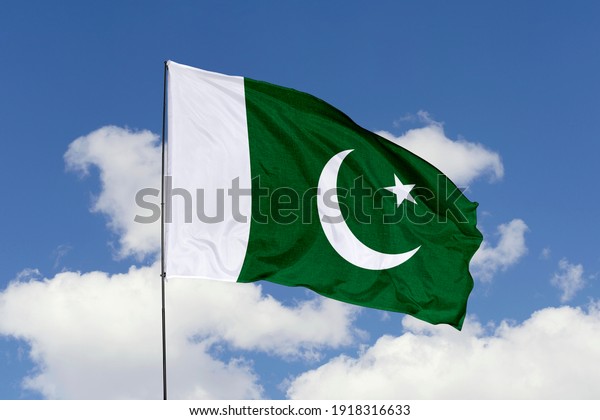 Pakistan flag\
isolated on white with clipping path. close up waving flag of\
Pakistan. flag symbols of\
Pakistan.