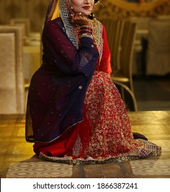 Pakistan Indian Bridal  Wearing Wedding Red Lehenga Suit, Bridal Getting Ready Her Wedding Day
Karachi, Pakistan, November 25, 2019