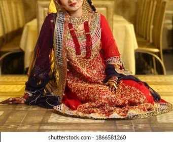 Pakistan Indian Bridal  Wearing Wedding Red Lehenga Suit, Bridal Getting Ready Her Wedding Day
Karachi, Pakistan, November 25, 2019