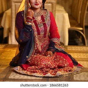 Pakistan Indian Bridal  Wearing Wedding Red Lehenga Suit, Bridal Getting Ready Her Wedding Day
Karachi, Pakistan, November 25, 2019