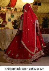 Pakistan Indian Bridal  Wearing Wedding Red Lehenga Suit, Bridal Getting Ready Her Wedding Day
Karachi, Pakistan, November 25, 2019