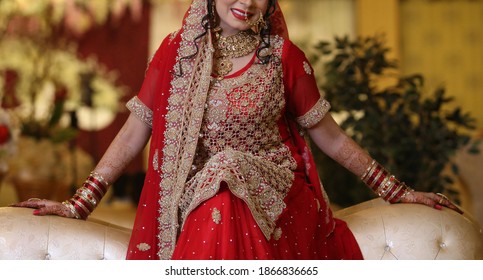 Pakistan Indian Bridal  Wearing Wedding Red Lehenga Suit, Bridal Getting Ready Her Wedding Day
Karachi, Pakistan, November 25, 2019